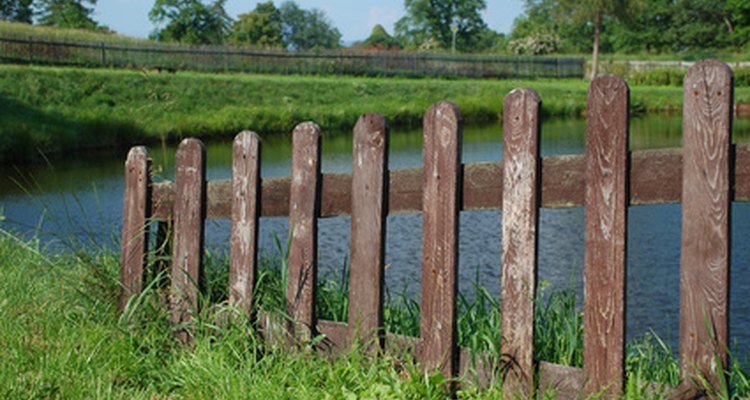 Spaced picket fences allow wind to pass through the slats.