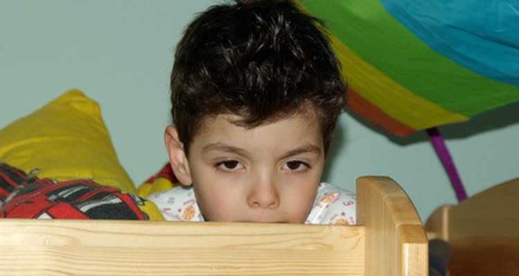 Raise the top bunk if it is too low.