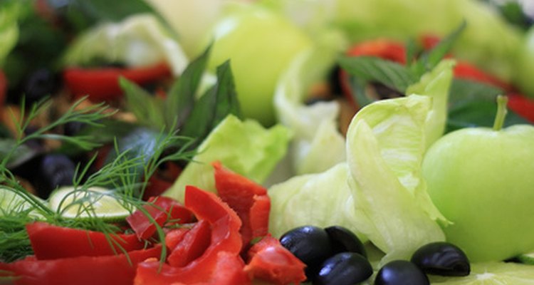 Wrap assorted freshly cut fruits and vegetables in foil before storing