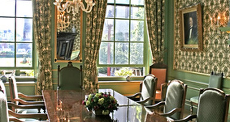 Pleated drapes behind cornice.