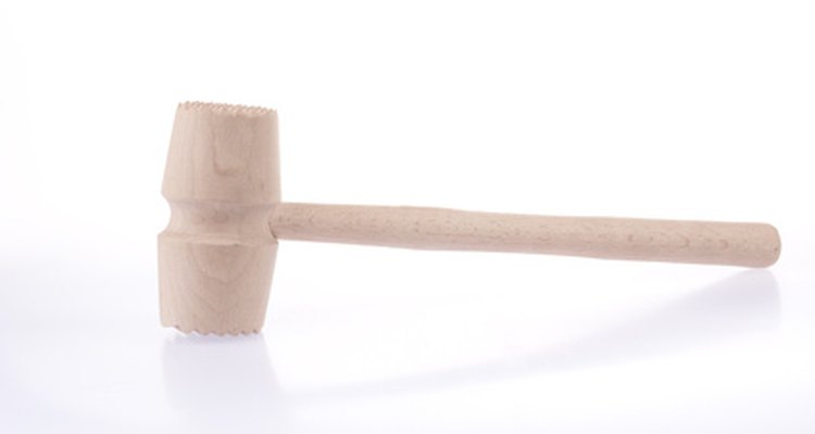 Pound chicken breast with a meat mallet.