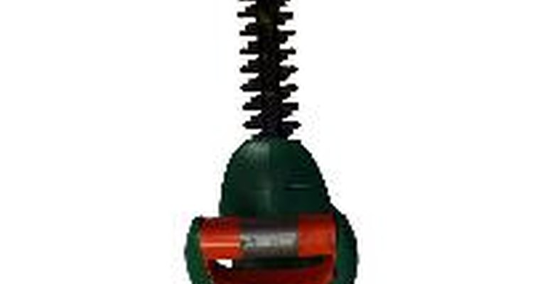 Hedge trimmers use pull cords wrapped around pulleys to start cold engines.