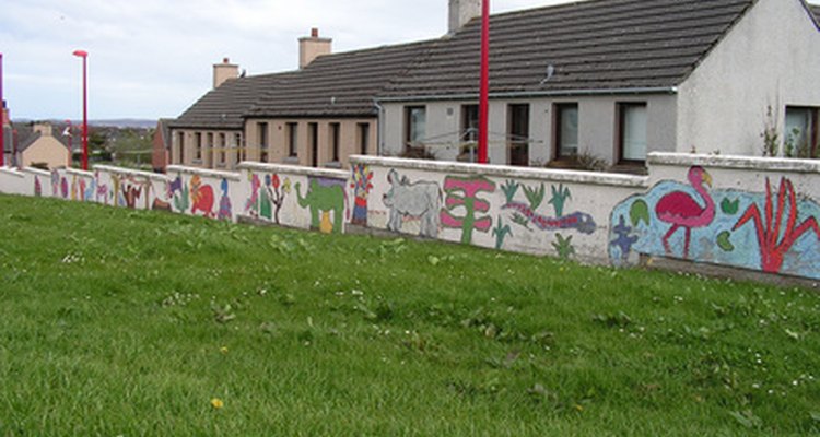 Projecting an image onto a wall makes painting a mural easier.