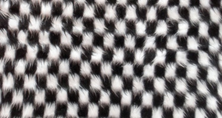 The hound's tooth pattern hides minor stains.