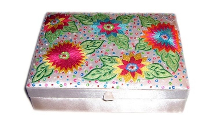 A fabric-covered wooden box can hold your knitting supplies or personal treasures.