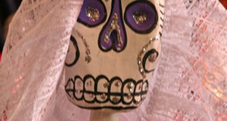 Using a plaster of Paris base adds strength to paper mache statues.