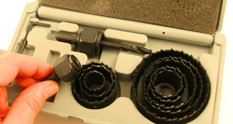 Hole saw attachments cut neatly through cabinet walls.