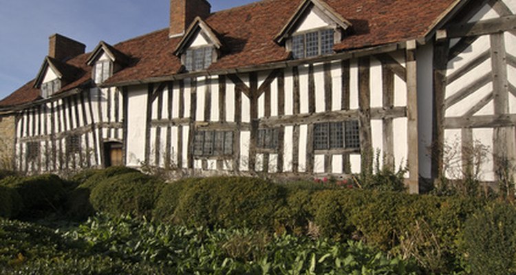 Make a simple model of a Tudor house from cardboard shoeboxes.