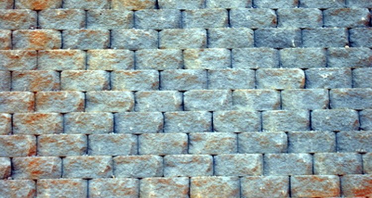 Stacked retaining-wall block does not require mortar.