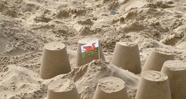 Use old flower pots for sand play.
