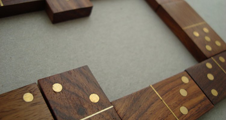 Making wooden dominoes is slightly challenging but can be done at home.