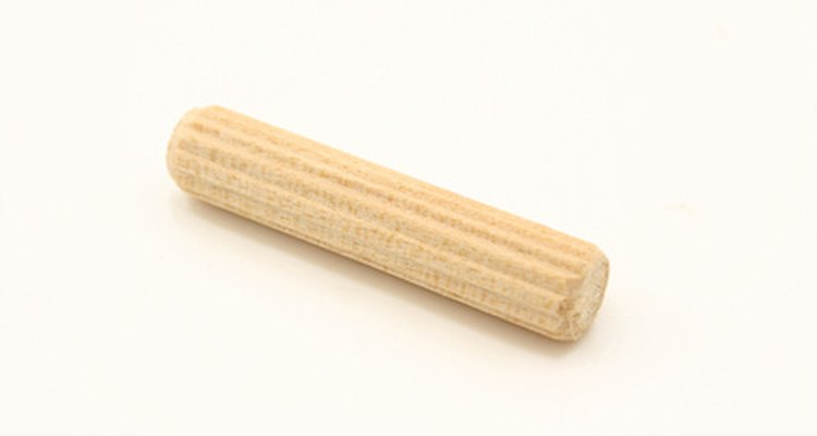 Compression creates friction between a wooden dowel and a drilled hole.