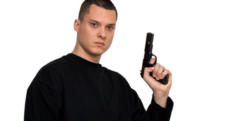 Adding a fake handgun to the costume lends a more realistic touch.