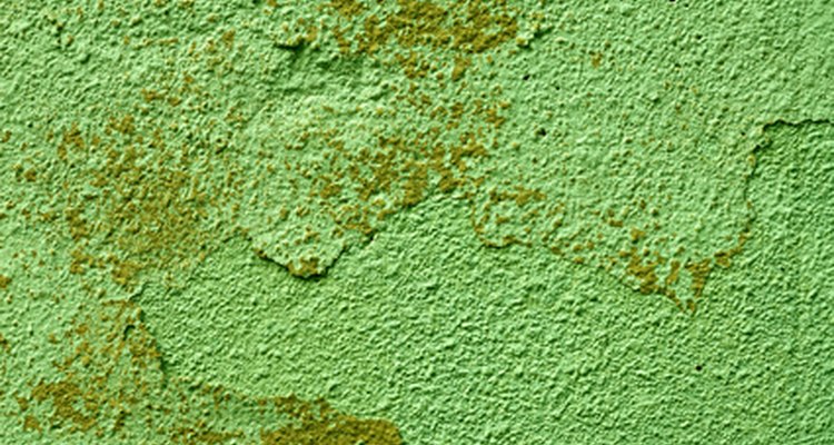 Remove distemper paint.