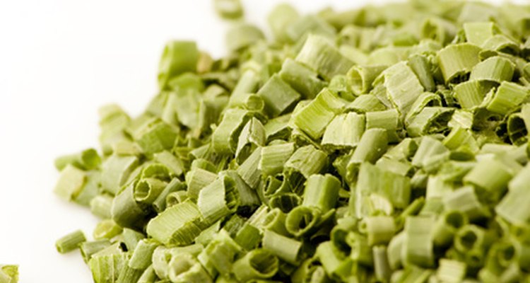 Rehydrate herbs, such as chives, with water.