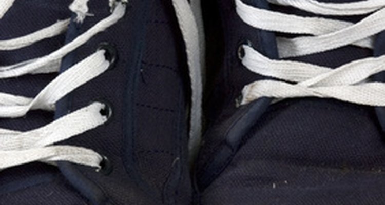 Removing white Shoe Goo from black canvas is possible.