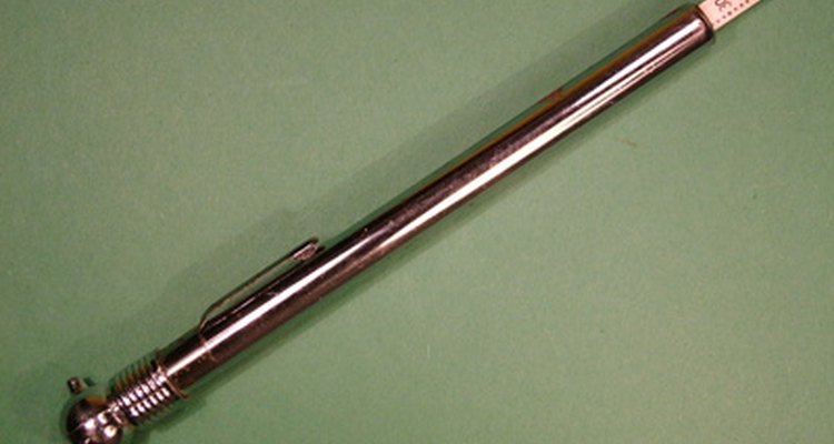 A tire gauge is used to measure the air pressure in the tires.