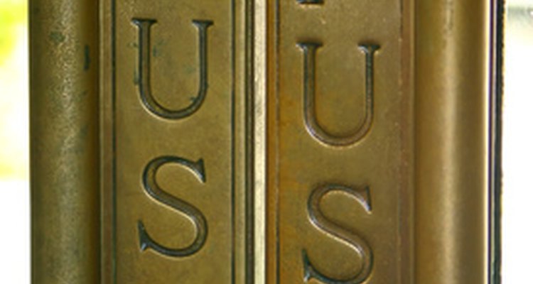 Decorative finger plates on a pair of swinging doors.