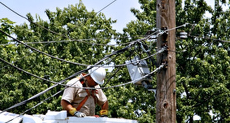 Linemen work on power lines.