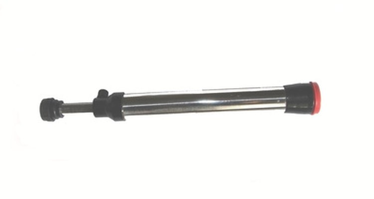 You can make a refractor telescope, such as this one, by using PVC tubes and an overhead projector lens.