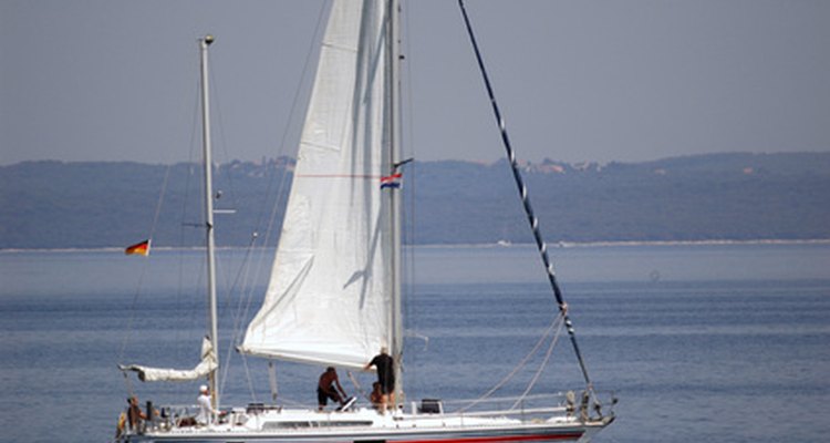 Sail boat rigging has a pulley system to bring the sails up and down.
