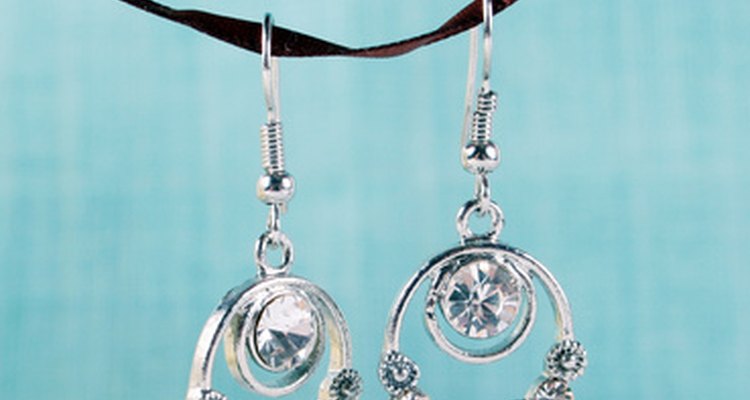Earrings adorned with iolite are an appropriate gift idea for a 21st anniversary.