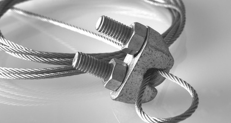 The cables should be clamped between the clamp and the U-bolt.