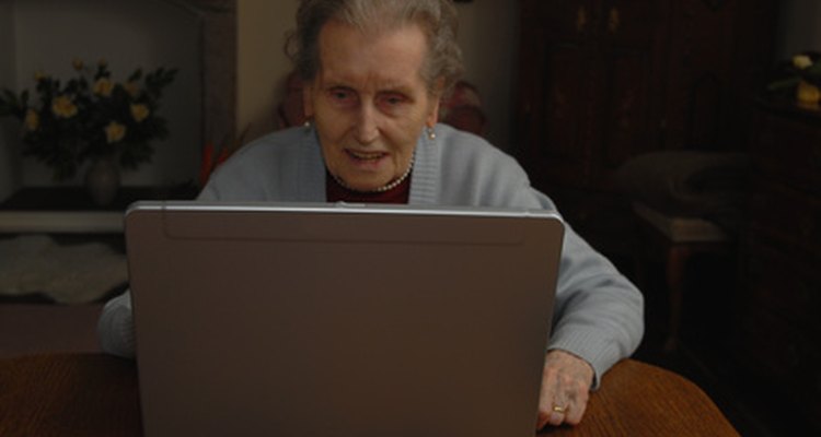senior citizen playing on computer