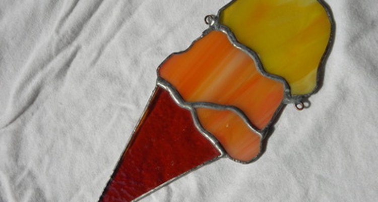 Painting on a transparency will mimic stained glass.