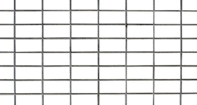 Make a grid in Photoshop CS2 by creating your own pattern fill.