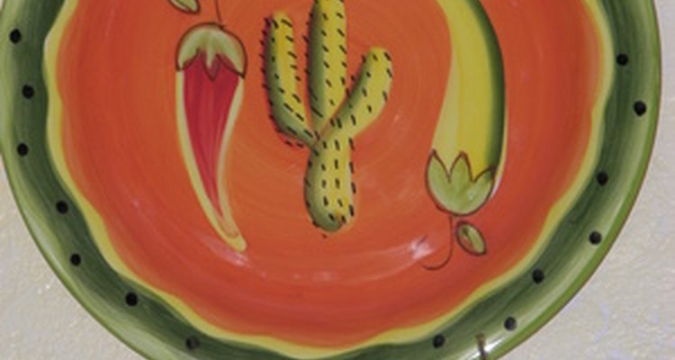 Drill a hole in a whimsical dinner plates to make a clock for the kitchen wall.
