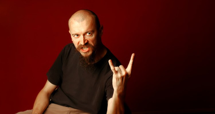 Many men embrace their receding hairline with a shaved or buzzed look.
