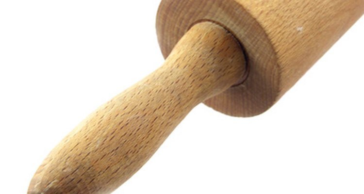 A standard kitchen rolling pin works to flatten the clay.