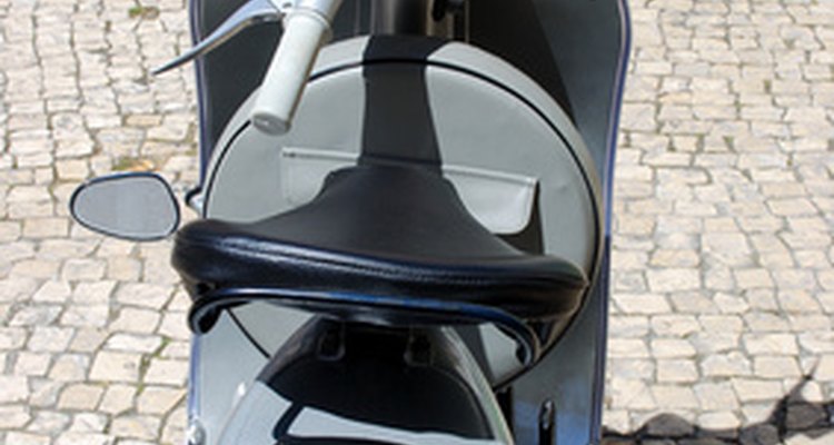 Remove the seat to reach the battery.