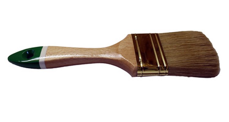 Paintbrushes are a good tool for applying chemical stripper.