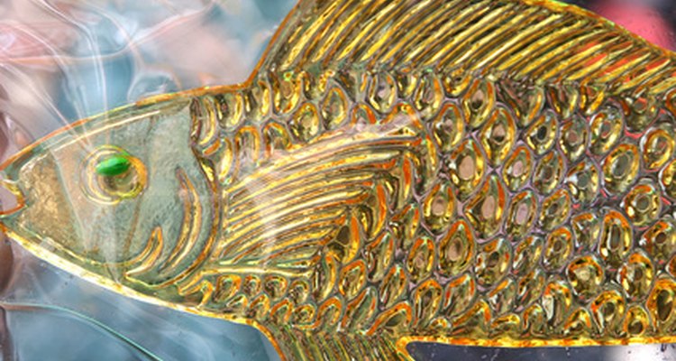 Paint scalloped fish scales with a mixture of white and yellow paint.
