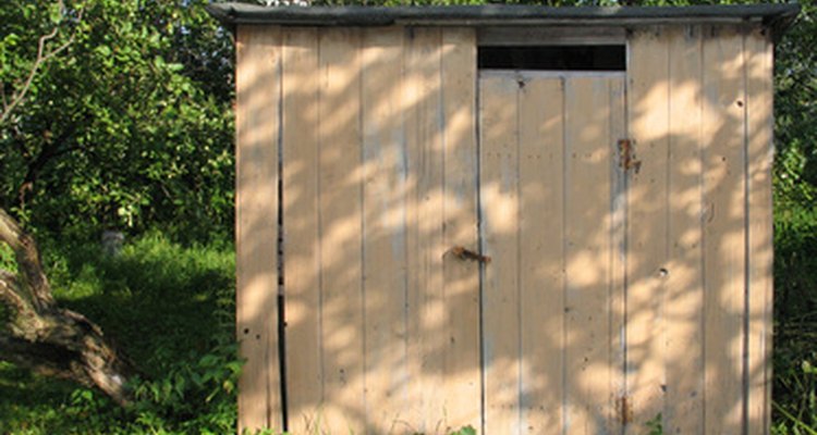 You can make a simple shed with a two-pallet floor and a shallow-pitch, single-sheet roof.