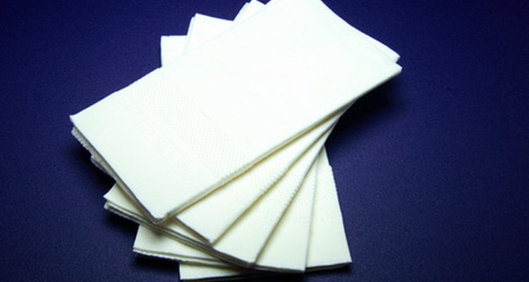 Folding napkins into cat ears makes a nice addition to your dinner layout.
