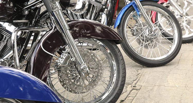 Measuring the rim of a motorcycle.