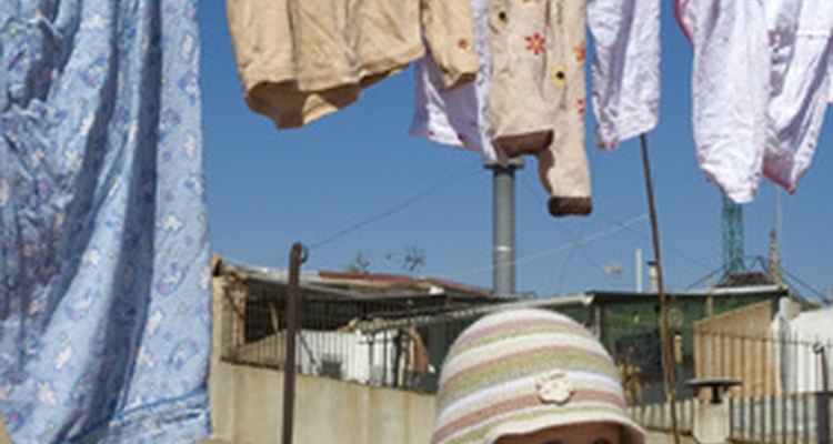 Homemade wooden clothesline props help make air-drying clothes an easy task.