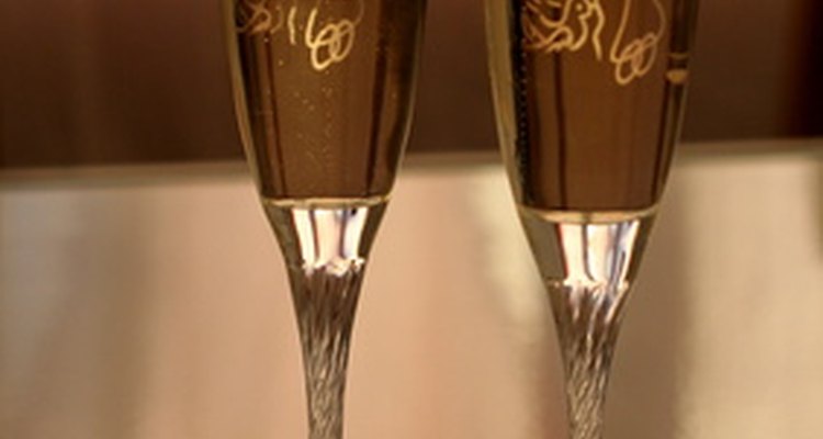 Decorate plastic champagne flutes by etching them.