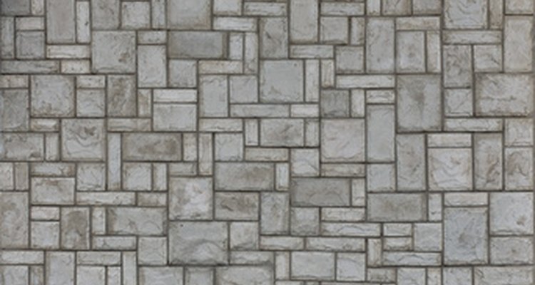 Concrete serves as wall cladding with pieces arranged in irregular designs.