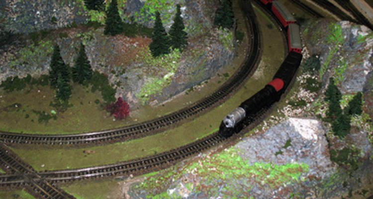 Make a cave where the toy train enters and comes out the other side.