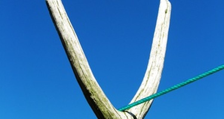 Clothesline props made from long, straight branches have a natural look.