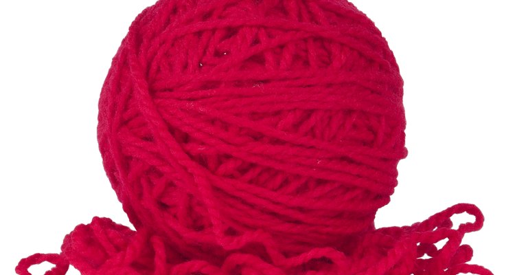Worsted weight yarn is used to knit a winter nose warmer.