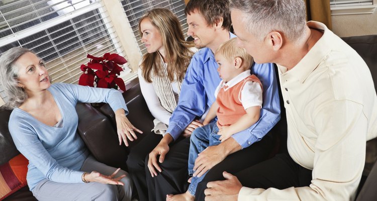 Grandparents Talking to Children's Family in Living Room