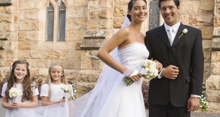 Bride and groom with flower girls