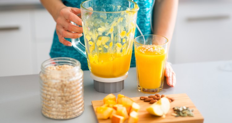 Closeup of smoothie with fresh fruits, seeds, nuts and oats