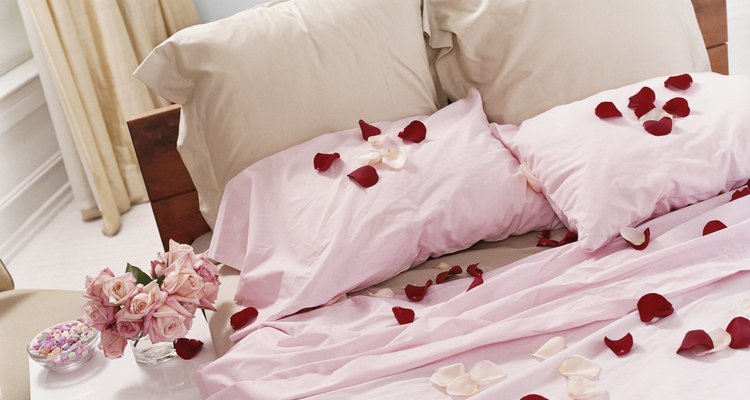 Bed Covered with Scattered Rose Petals