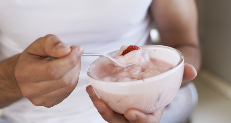 Hands holding yogurt